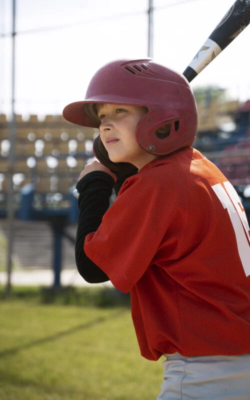 side-view-kid-holding-baseball-bat